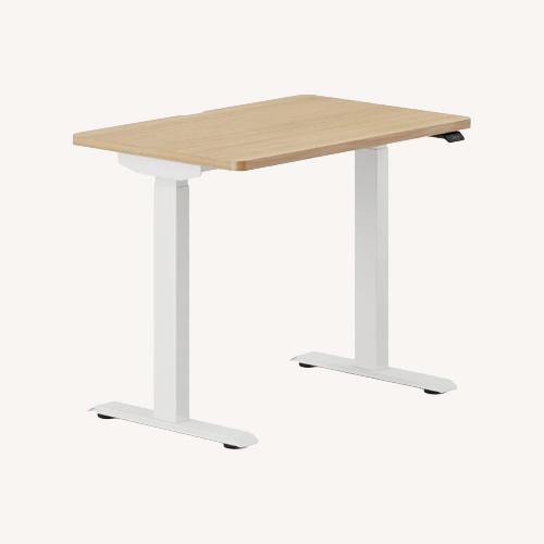 Used Branch Duo Standing Desk Natural Wood Desk for sale on AptDeco