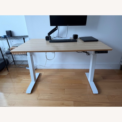 Used Branch Duo Standing Desk Natural Wood Desk for sale on AptDeco