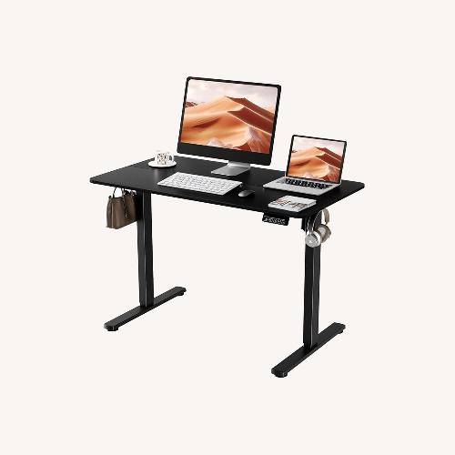 Used Black Standing Desk, Height Adjustable Electric for sale on AptDeco