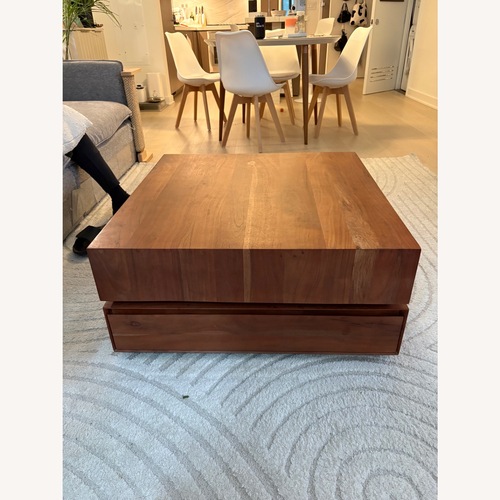 Used CB2 Dark Brown Wood Rotating Coffee Table for sale on AptDeco