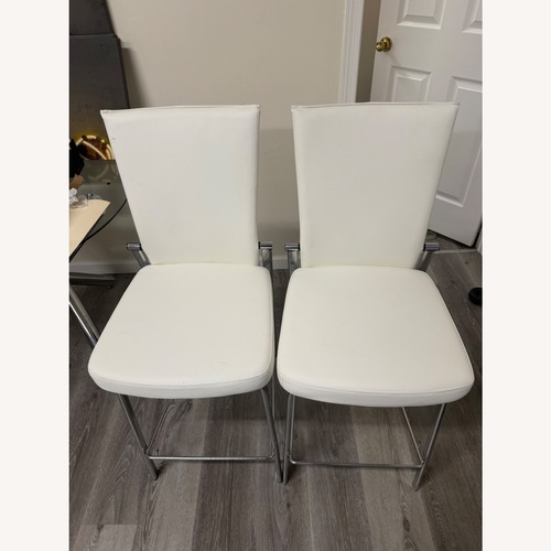 Used Raymour & Flanigan Paloma White Dining Chairs for sale on AptDeco