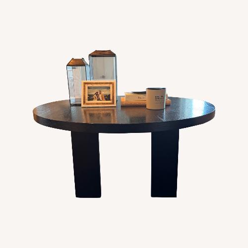 Used Black Wood Dining Table for sale on AptDeco