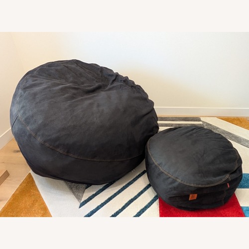 Used Cordaroys Original Black Faux Leather Queen Bed for sale on AptDeco