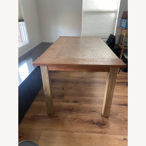 Used Crate & Barrel Natural Wood Dining Table for sale on AptDeco