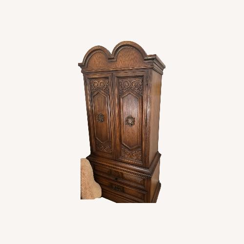 Used Antique Dark Brown Wood Armoire for sale on AptDeco
