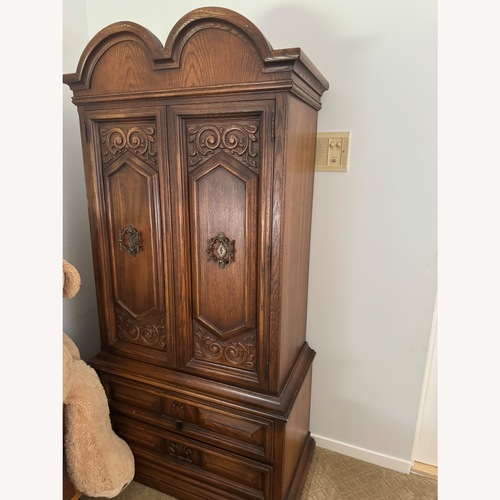 Used Antique Dark Brown Wood Armoire for sale on AptDeco