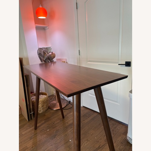 Used Article Seno Dark Brown Wood Dining Table for sale on AptDeco