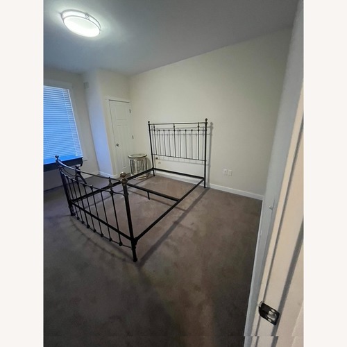 Used Charles P. Rogers Black Iron Queen Bed for sale on AptDeco