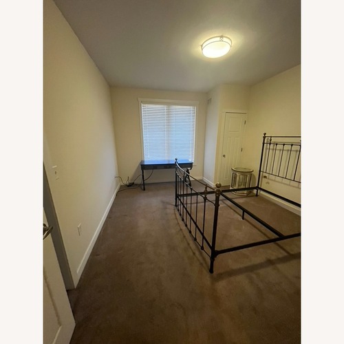 Used Charles P. Rogers Black Iron Queen Bed for sale on AptDeco