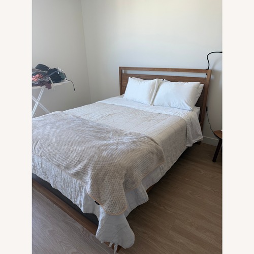 Used Crate & Barrel Linea Natural Wood Queen Bed for sale on AptDeco