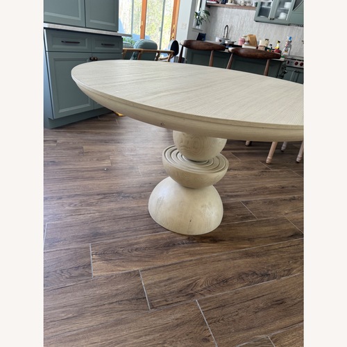 Used Anthropologie Sonali White Wood Dining Table for sale on AptDeco