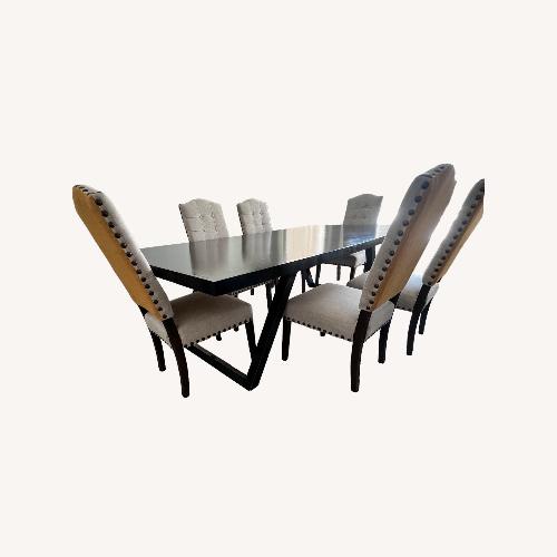 Used Home Goods Black Wood Dining Table for sale on AptDeco