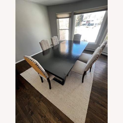 Used Home Goods Black Wood Dining Table for sale on AptDeco