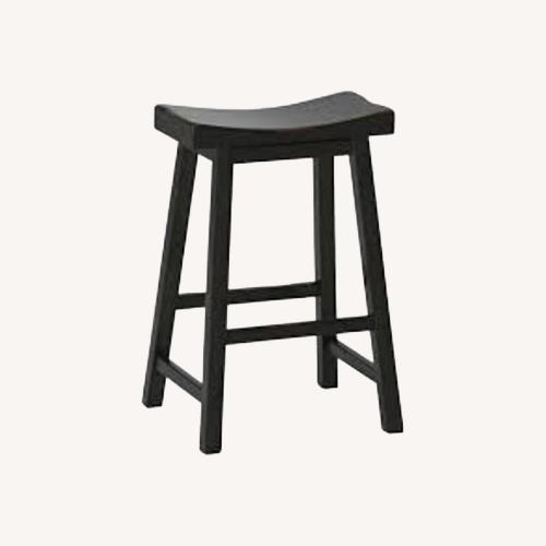 Used Pottery Barn Tibetan Black Wood Stools for sale on AptDeco