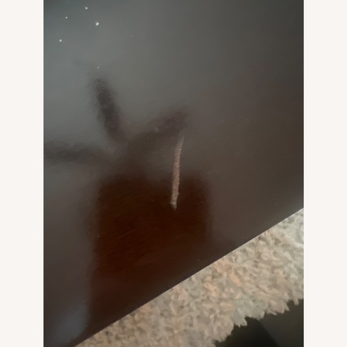 Used Living Spaces Dark Brown Wood Coffee Table for sale on AptDeco