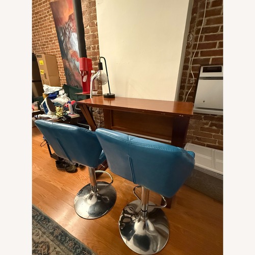 Used Teal Faux Leather Barstools (Set of 4) for sale on AptDeco