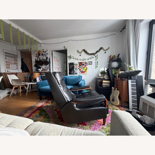 Used Vintage Milo Baughmagn Black Leather Recliner for sale on AptDeco