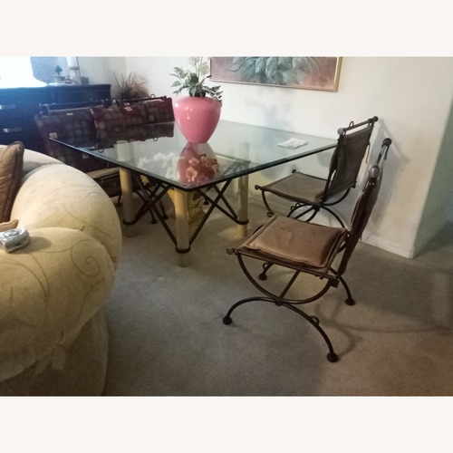 Used Dark Gray Metal Dining Table for sale on AptDeco