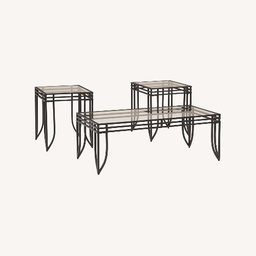 Used Ashley Furniture Black Glass Coffee Table for sale on AptDeco