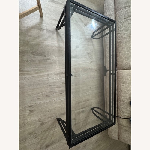 Used Ashley Furniture Black Glass Coffee Table for sale on AptDeco