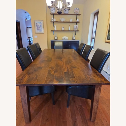 Used Arhaus Dark Brown Wood Dining Table for sale on AptDeco