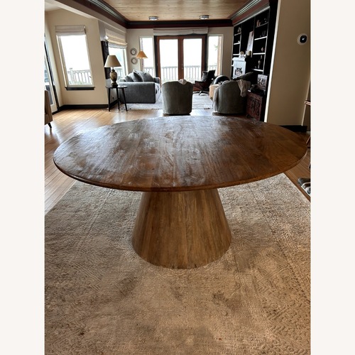 Used World Market Light Brown Wood Dining Table for sale on AptDeco