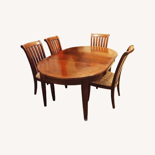 Used Extendable Table + 4 Cushioned Chairs for sale on AptDeco