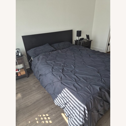 Used IKEA Black Wood Queen Bed for sale on AptDeco