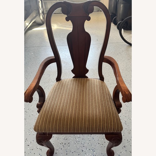 Used Dark Brown Wood Dining Chair for sale on AptDeco