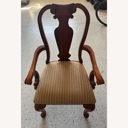 Used Dark Brown Wood Dining Chair for sale on AptDeco