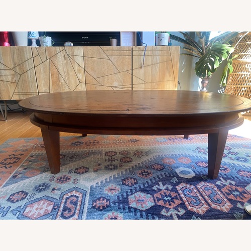 Used Tomlinson Vintage Oval Coffee Table  for sale on AptDeco