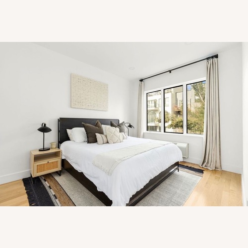 Used Pottery Barn Warren Black Wood King Bed for sale on AptDeco