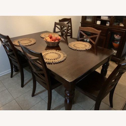 Used Ashley Furniture Rustic Brown Wood Dining Set for sale on AptDeco