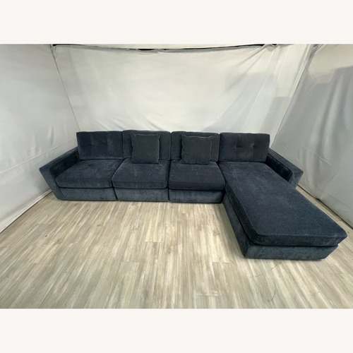 Used Raymour and Flanigan Modular Sectional and Chaise for sale on AptDeco