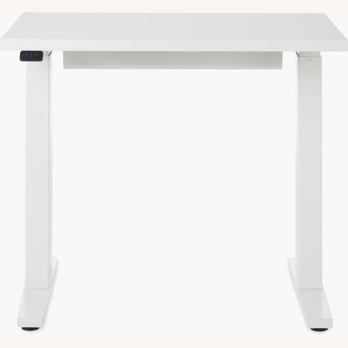 Used Herman Miller Motia Sit/Stand White Desk for sale on AptDeco
