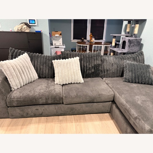 Used Rooms To Go Light Gray 2 Piece Sectional for sale on AptDeco