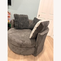 Rooms To Go Light Gray Fur and Hide Ottoman