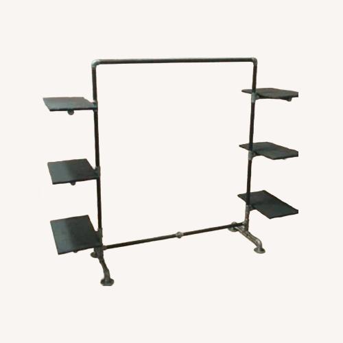 Used Industrial Pipe Garment Rack w Wood Shelves for sale on AptDeco