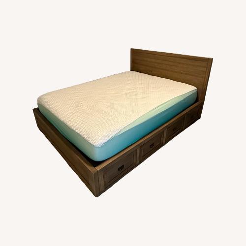 Used Wooden Queen Bed Frame with Drawers for sale on AptDeco