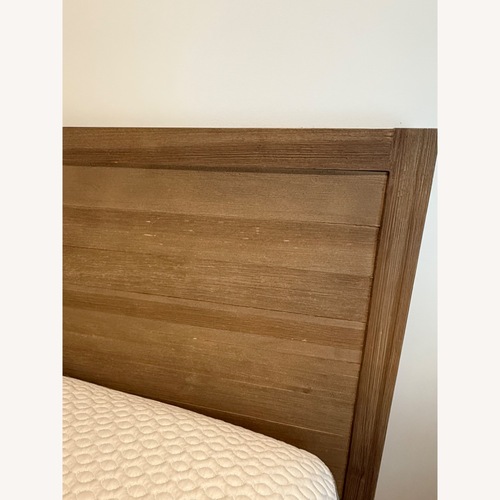 Used Wooden Queen Bed Frame with Drawers for sale on AptDeco
