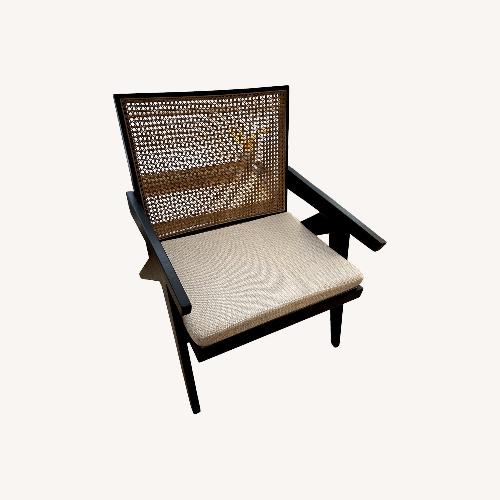 Used Black Wood and Natural Rattan Armchair for sale on AptDeco