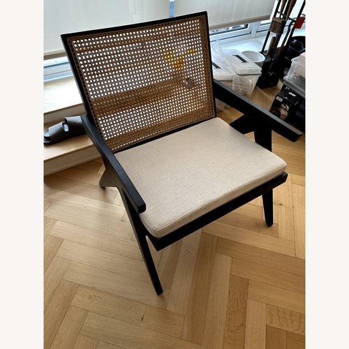 Used Black Wood and Natural Rattan Armchair for sale on AptDeco