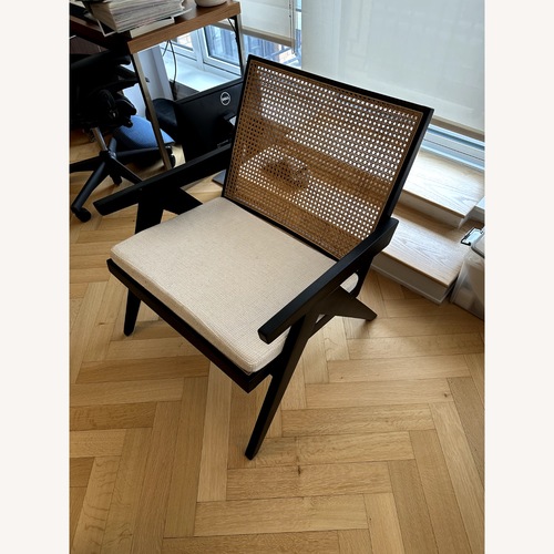 Used Black Wood and Natural Rattan Armchair for sale on AptDeco