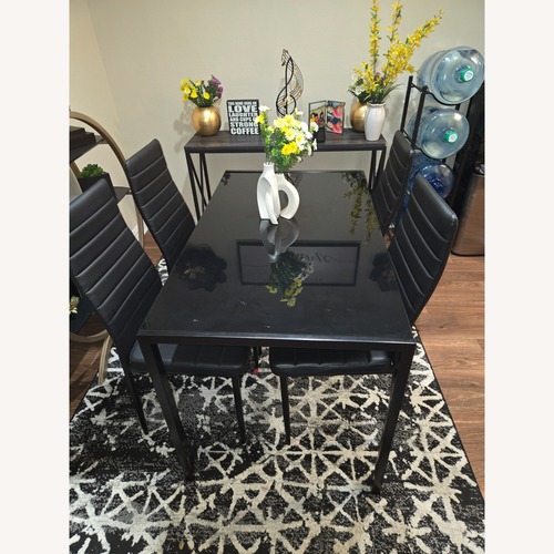 Used Black Glass Dining Set for sale on AptDeco