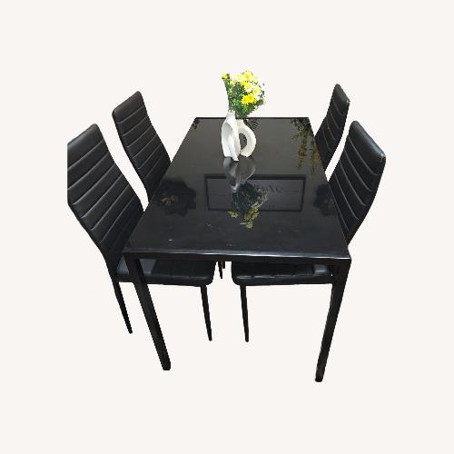 Used Black Glass Dining Set for sale on AptDeco
