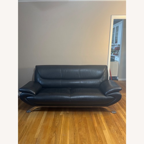 Used Raymour & Flanigan Black Leather Sofa for sale on AptDeco