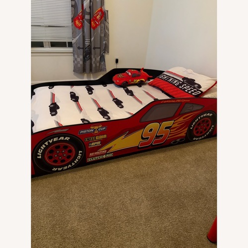 Used Rooms To Go Red Wood Twin Bed for sale on AptDeco