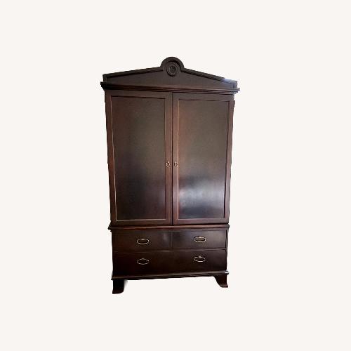 Used Dark Brown Wood Armoire for sale on AptDeco
