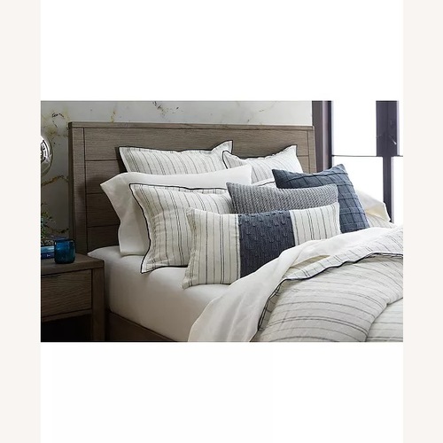 Used Macy's Light Gray Wood Queen Bed for sale on AptDeco