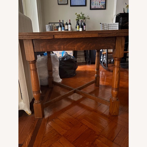 Used Solid Wood Antique Dining Table with Leaves  for sale on AptDeco